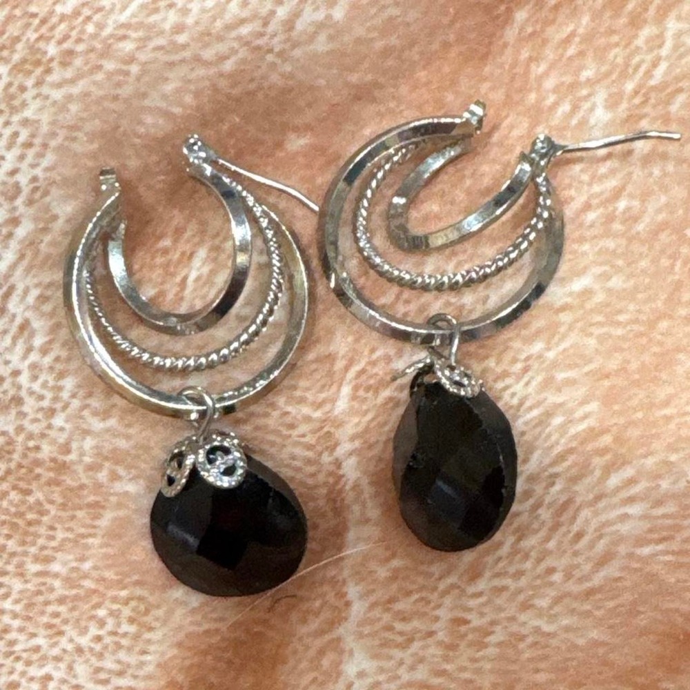 Silver hoop earrings with black teardrop beads and rhinestone accents
